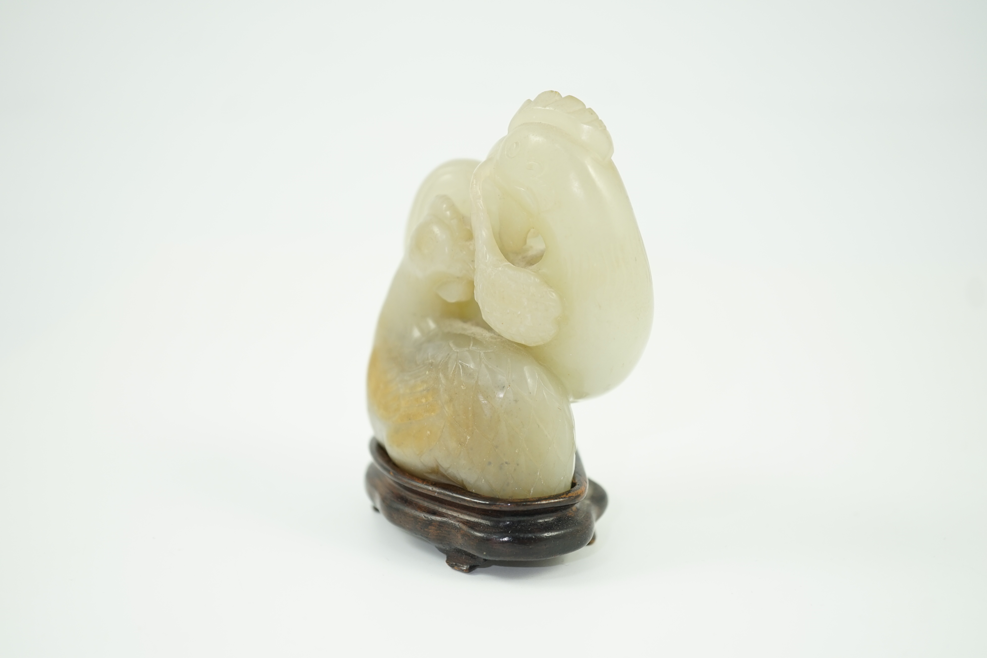 A Chinese pale celadon jade chicken group, 19th century, small faults